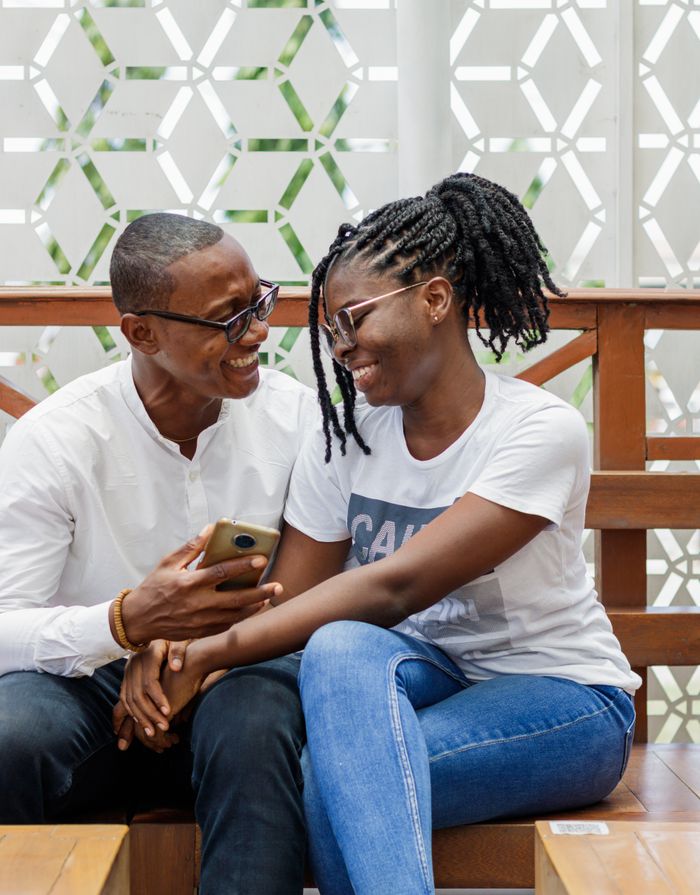 Smiling couple enjoying time outdoors, sharing a genuine connection.